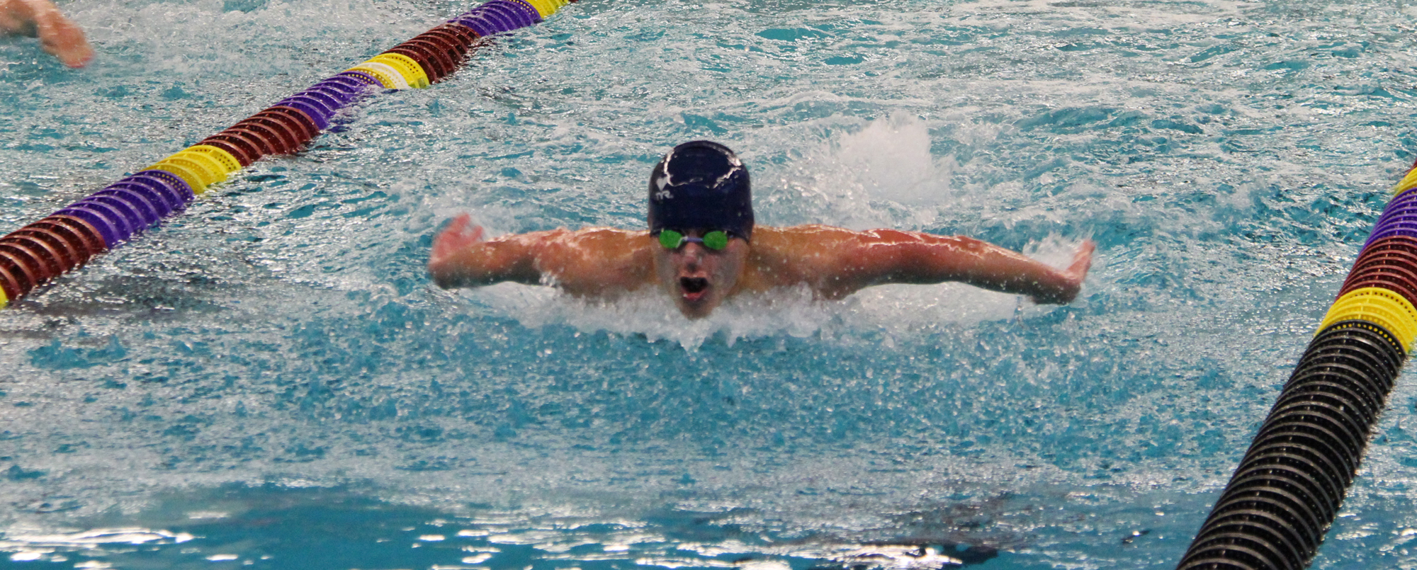 Men's swimming beats Tabor for first win