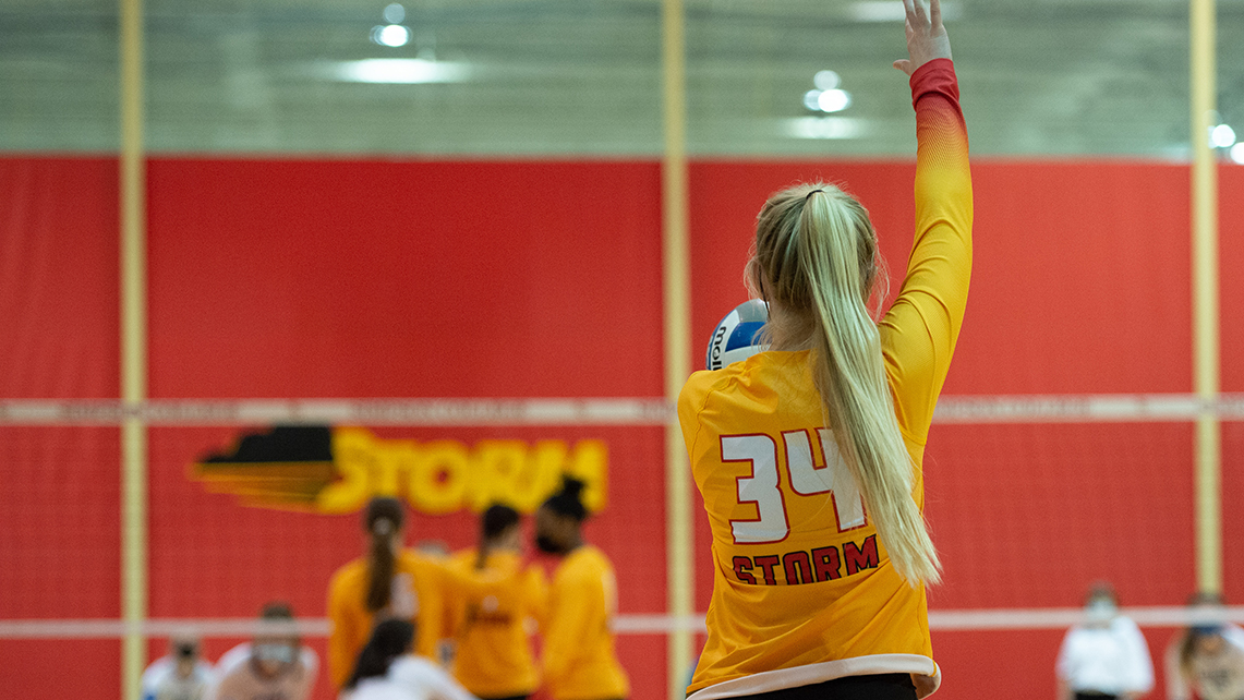 The Simpson College volleyball team gets ready to serve.