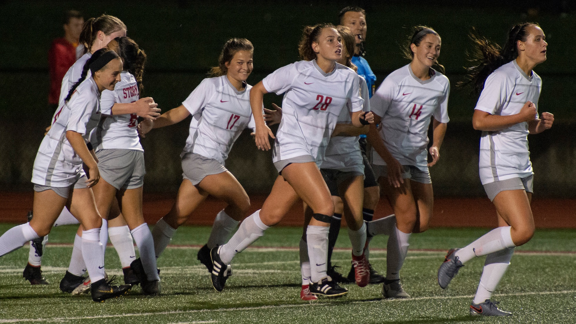 The Storm celebrate an 86th-minute goal by Lizzie Arnburg to tie the game at 2-2 against Wartburg.